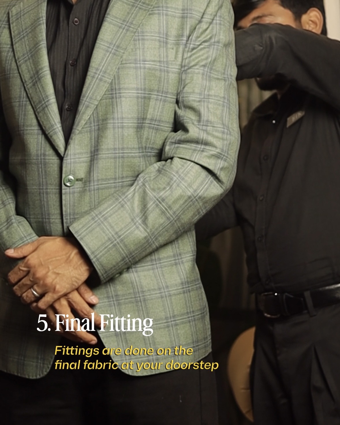 Tailor expertly stitching a suit by hand